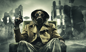 man in gas mask with gun